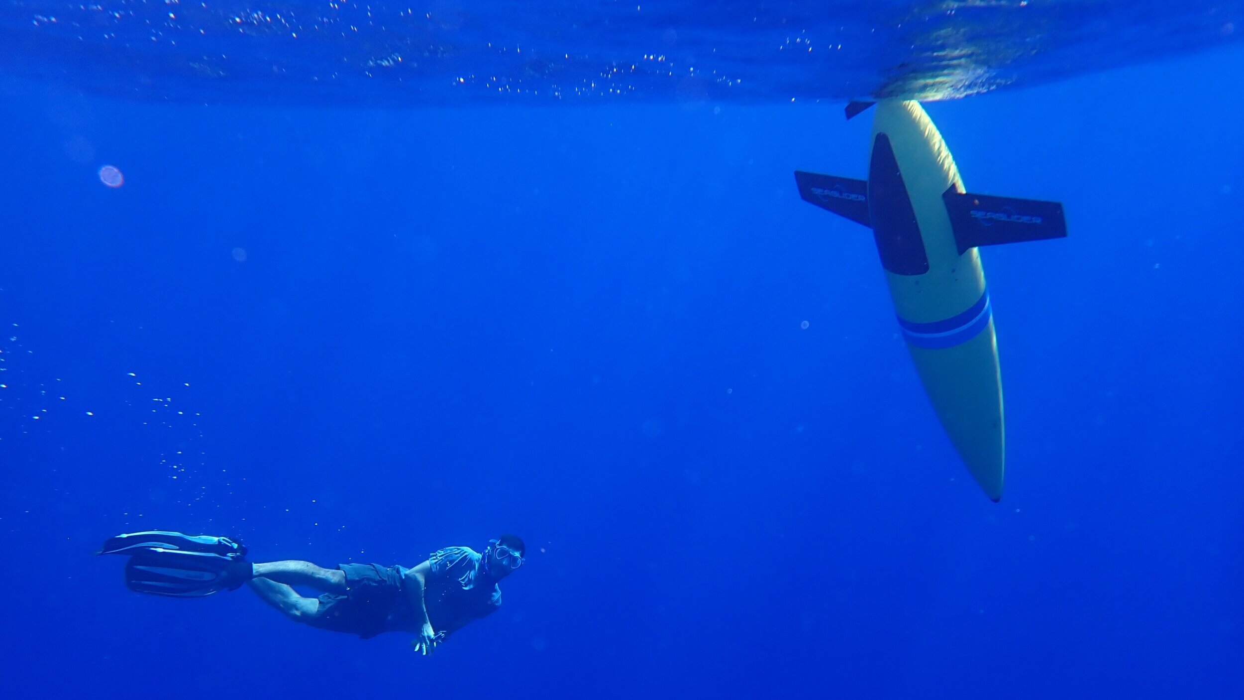 Dr. Nick Higgs of the Cape Eleuthera Institute dives alongside the glider during its launch.