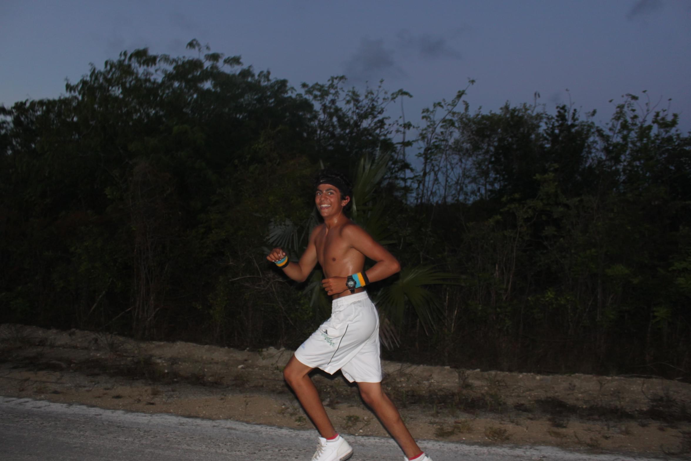 Evan running during run track at The Island School, Spring 2011