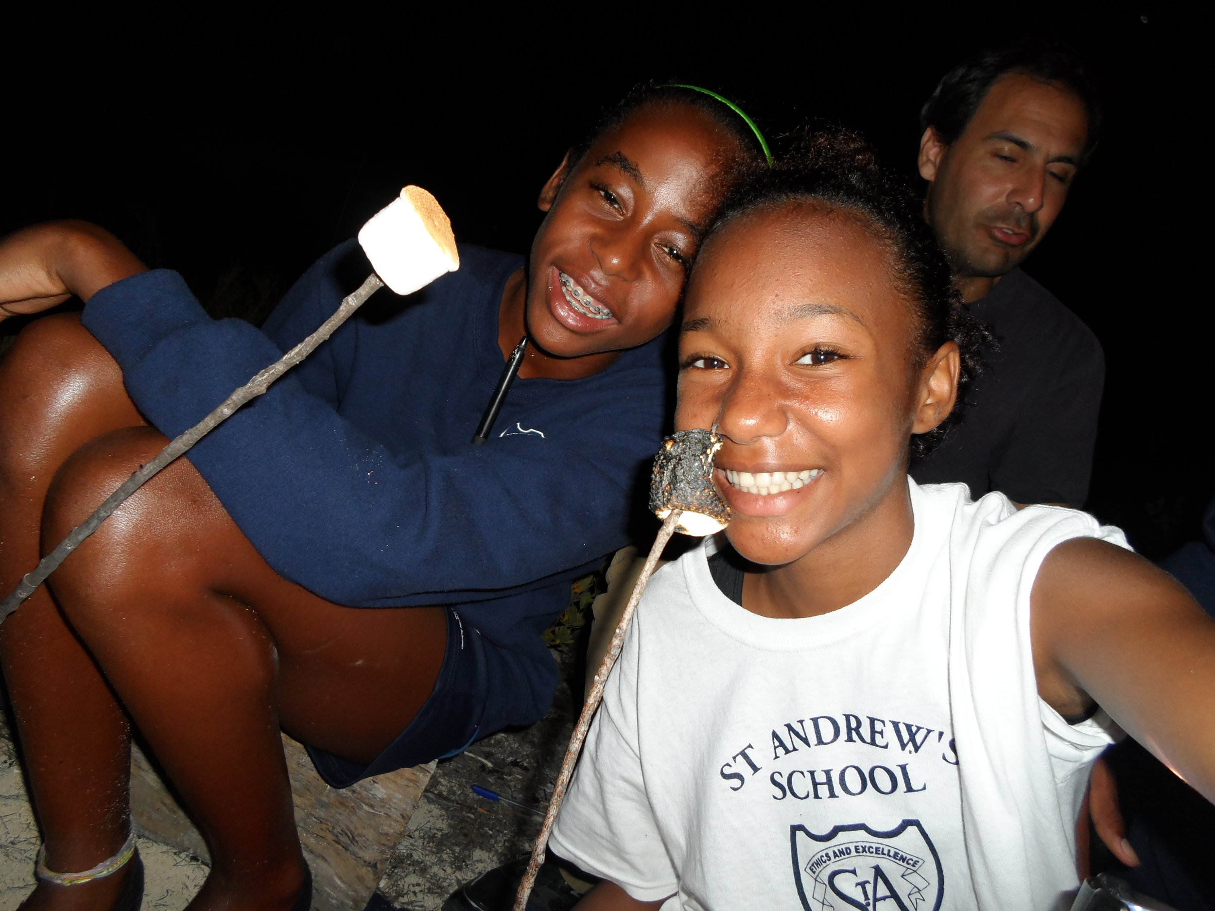 St. Andrews' students enjoying a beach bonfire on their last night.