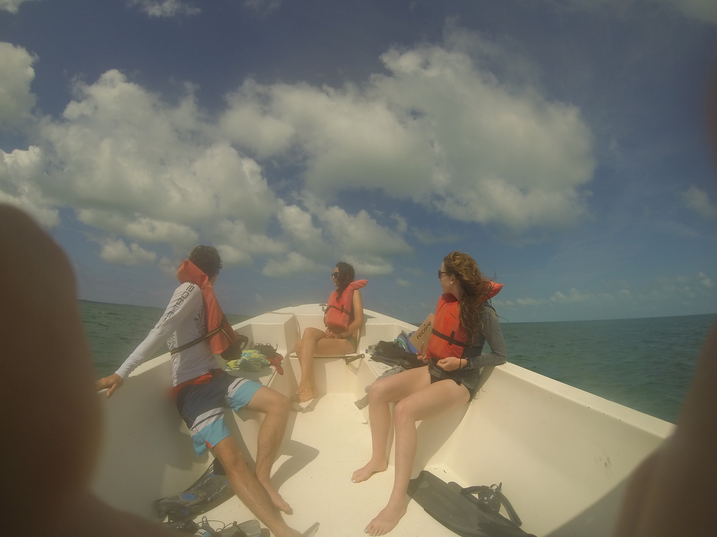 Students out on a boat on their way to the patch reefs