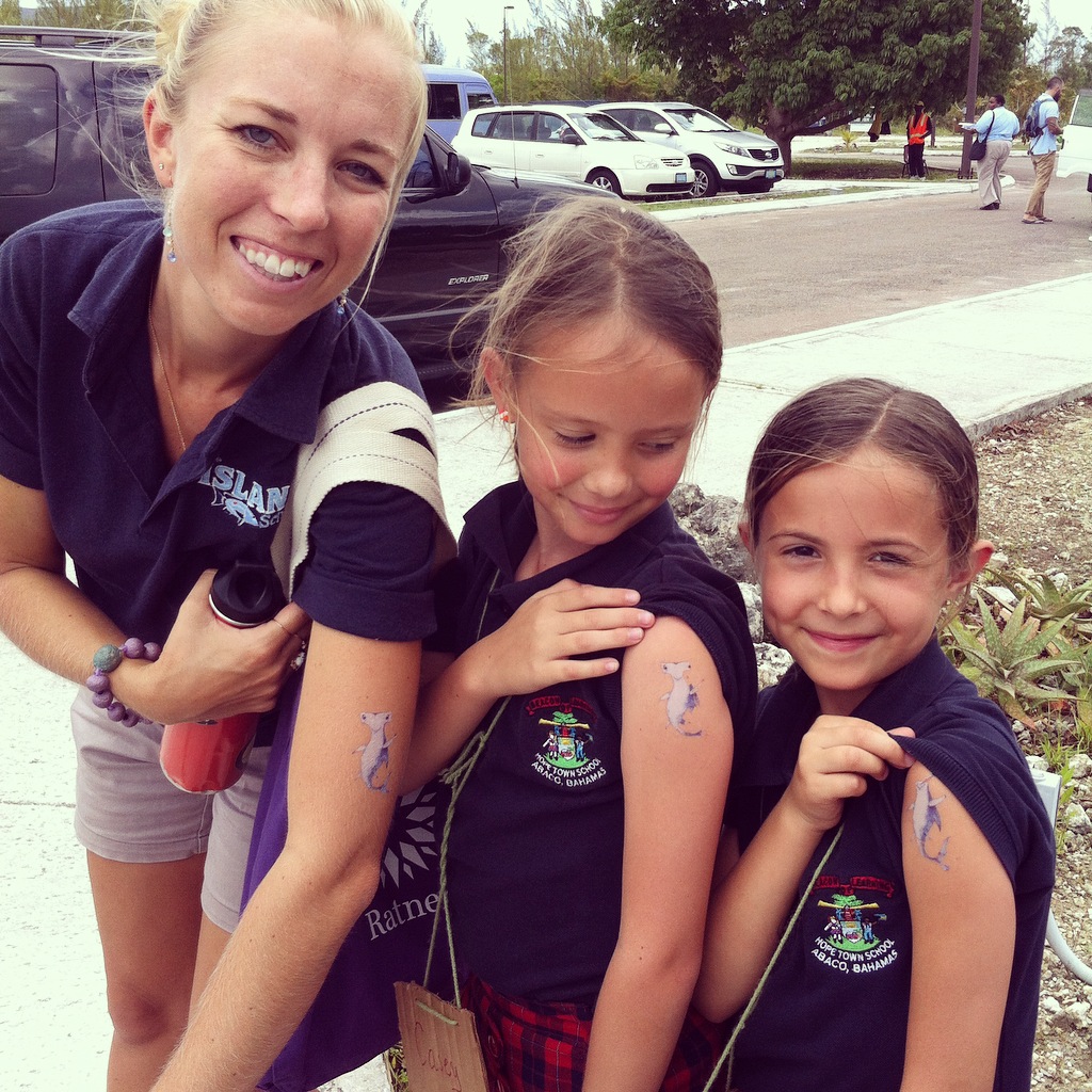 Tiffany Gray and students from Hope Town Primary School show off their shark Stanley tattoos.