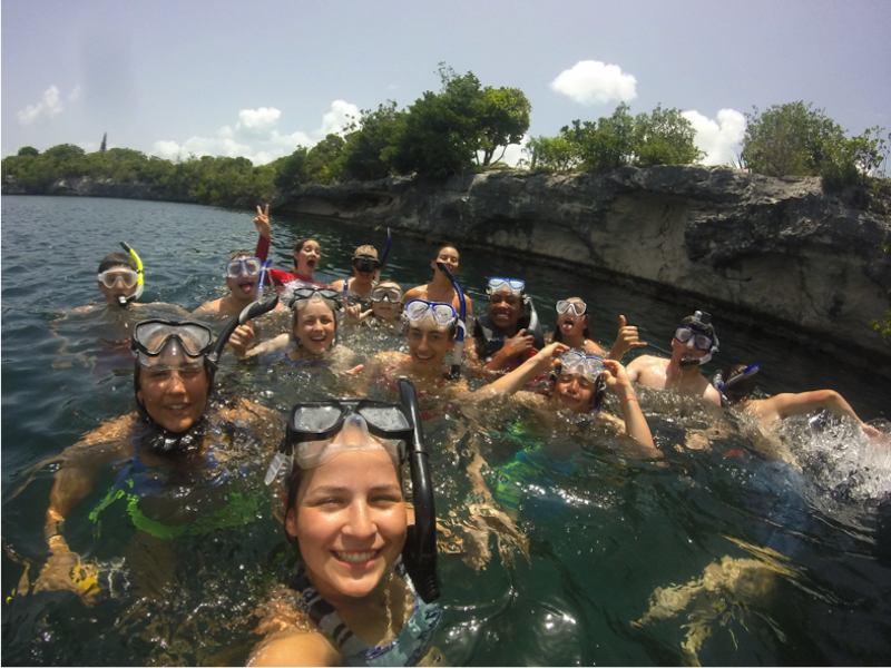 Students posing for a picture while snorkeling 